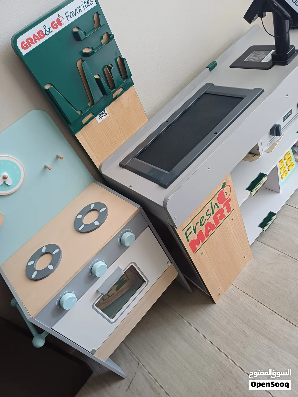 Wooden play kitchen and supermarket checkout