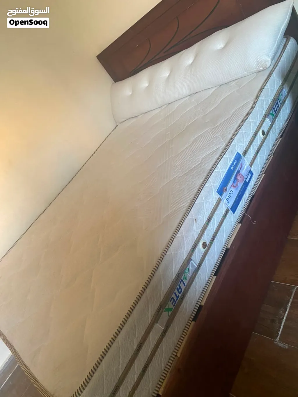 comfortable and supportive latex mattress, suitable for a queen-size bed. Clean and well-maintained