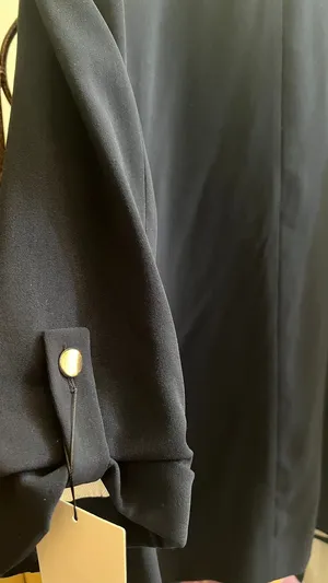 A brand-new formal coat from Zara. Bought for OMR 29.900 and selling for OMR 10.