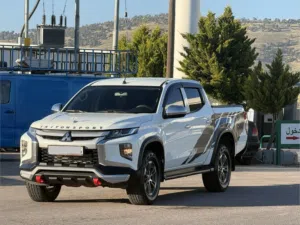 MITSUBISHI_L200 2023 - 4*4 / فحص كامل/جير عادي /دهان الشركة/ وارد الشركة الأردنية /
