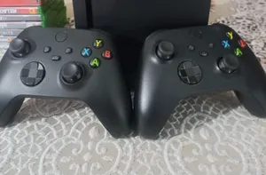 xbox series x with 2 controllers and a bundle of 9 games