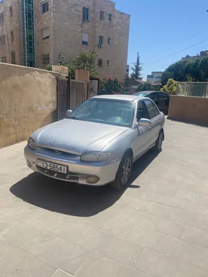 سيارة هيونداي اكسنت 1998 موديل فضي مستعملة مع مواصفات كوريا وجنوط