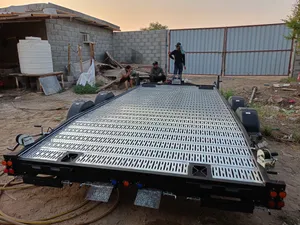 The selected region shows a heavy-duty dual-axle flatbed car carrier trailer equipped with a front-m