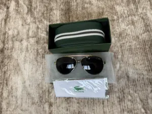 Lacoste L152S Premium Sunglasses – Stylish Gold Frame with Original Case & Box