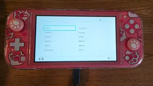 Nintendo Switch Lite Coral + Cat Paw Case & Thumb Grips