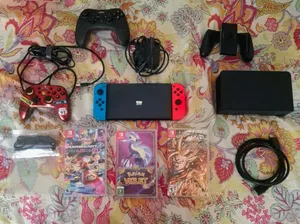 Nintendo Switch OLED (Neon Red/Blue) Bundle + 3 Physical Games + 2 Extra Controllers + 128GB SD