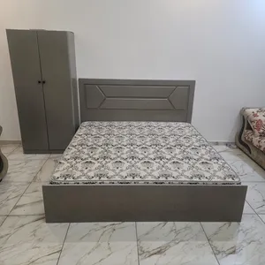 Double bed with mattress and wardrobe