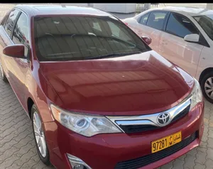 تويوتا كامري 2012 XLE أحمر موديل أمريكي مع ميزات متقدمة وبحالة جيدة