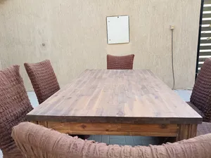 Solid wood table with 6 brown covered chairs