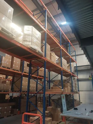 Used heavy-duty warehouse pallet racking systems and accessories for sale.