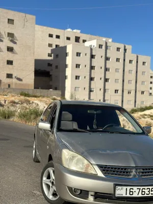 ميتسوبيشي لانسر 2004 موديل خليجي فل كامل مع جنوط وبلوتوث