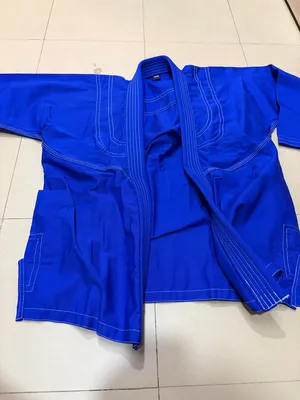 Jiu jitsu uniform with white belt. زي الجيو جيتسو بحزام أبيض.