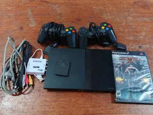 PS2 Slim معدل + يدين + كارت ميموري + ألعاب