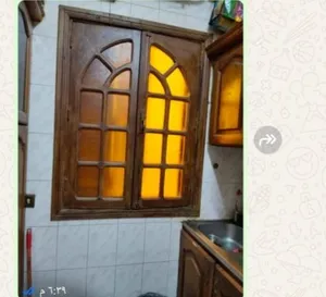 شباك خشب بمشتملاتة