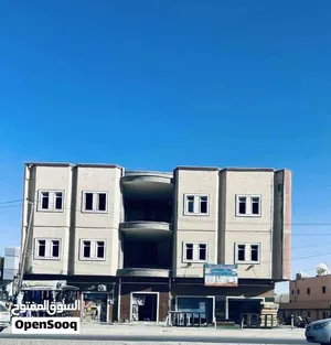 مبنى تجاري مقابل سوق الاحد و طريق الاحياء البرية