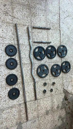 أوزان 6 حبات 5 كليو و 4 حبات ثنين كيلو و نص مع بار طول مع بار اعوج مع بارين زغار مع سوامينً عدد 4