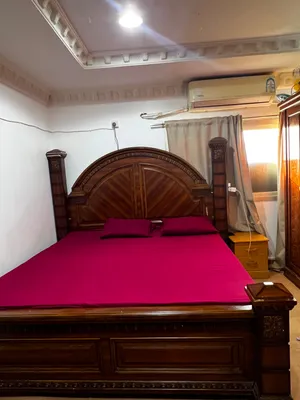 bed and mattress with side table