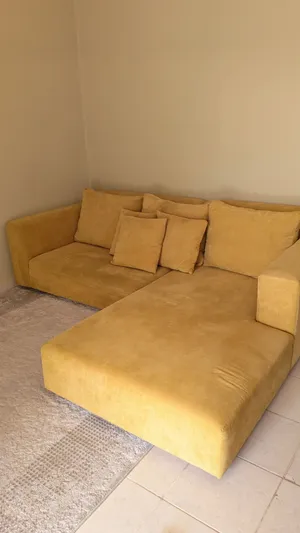 Mustard Gold L-shaped sofa with Chaise for sale.