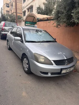 لانسر اللبيع موديل 2005 محدثه بالكامل 2012 حياكم الله اشرا ما رح نقصر معووو باذن الله