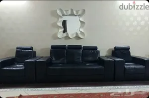 طقم كنب جلد أسود 7 مقاعد مستعمل قابل للتفاوض