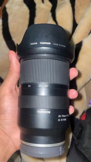 عدسه تامروا f2.8 75-28 شبه جديده مع الكرتون ( 220 )