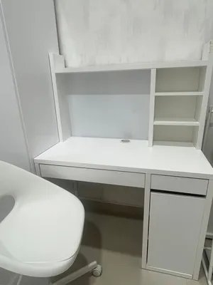 Desk has shelves with drawer with chair from IKEA