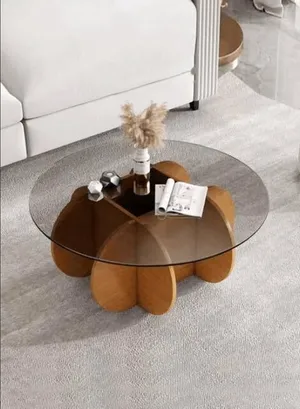 Round glass coffee table, wooden petal base