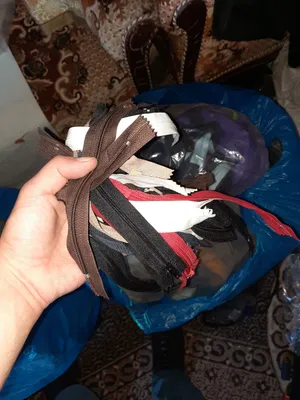 سحابات ملابس غير مفروزات بوزن تقريبي 76 كيلو