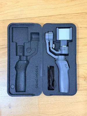 مانع اهتزاز (جمبل) DJI Osmo Mobile بحالة ممتازة جداً مع الملحقات