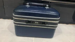 Vintage dark blue hard travel case for cosmetics/toiletware, with combination lock, small bag.