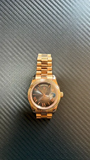 Oyster Perpetual Day-Date – Chocolate Dial Elegant gold-tone design with a chocolate dial, fluted