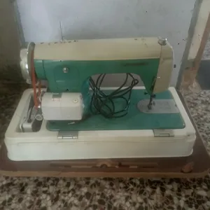 ماكنة خياطه جينومي