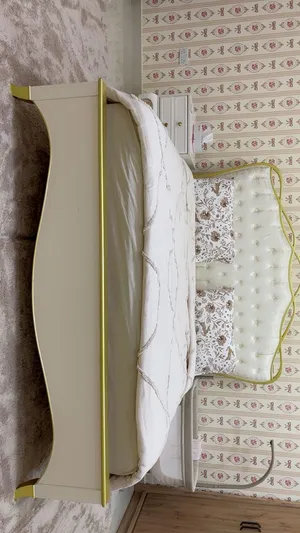 Bed king size with mattress and one side and poof