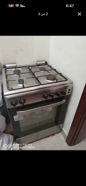 موقد غاز 4 رؤوس ممتازة مع نظام إشعال ذاتي (شرارة/تكة)مع فرن سفلي وعلوية وخزانة حفظ سفلية