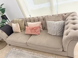 Beige Tufted Sofa & Mirrored Coffee Table