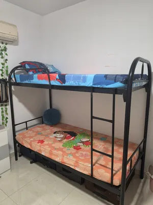 Metal Bunk Bed with 2 Mattresses in good condition. سرير معدني بطابقين مع مرتبتين بحالة جيدة.