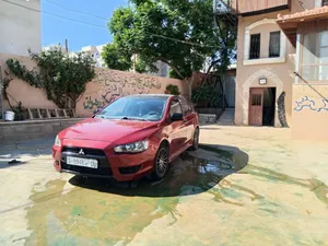 ميتسوبيشي لانسر موديل 2012 تسير 2014 اصل اجار السياره من ناحية البودي والمتور والجير نظاف