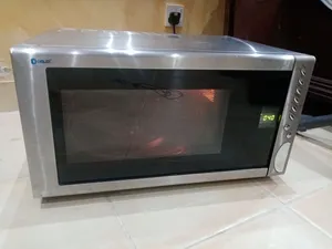 مكرويف من ماركة Donlim، موديل MO2888CG، بسعة 31 لتراً ستيل مقاوم لصدا شبه جديد
