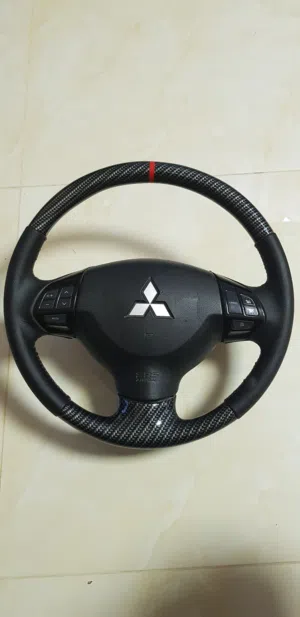 للبيع ستيرنج كاربون اصلي ميتسوبيشي لانسر lancer steering carbon ex gt glx gls
