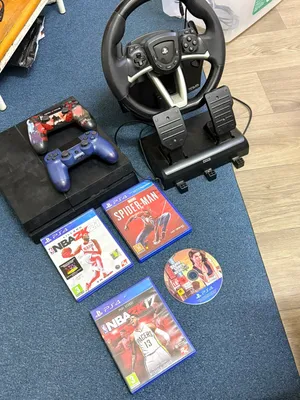 PS4 COMPLETE GAMING SETUP + STEERING WHEEL + GAMES — 125 BHD