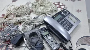 panasonic telecom + 6 cables+battery charger(  Salmiya)