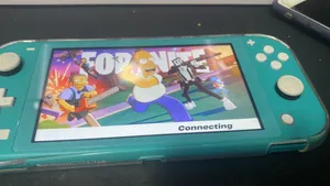 Niotendo switch lite baby blue coler perfect condition  able to trade