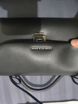 charles and keith crossbody bag black colour with black strap