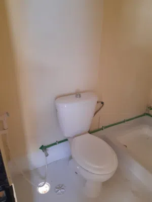 Refurbished plywood portacabin with two rooms and two toilets.