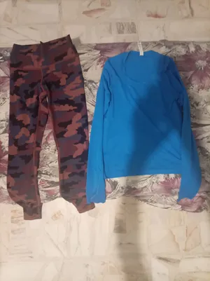 Lulu Lemon. Size 4..small for teenager girls. Blue blouse and black/brown  camo leggings. لولو لمون