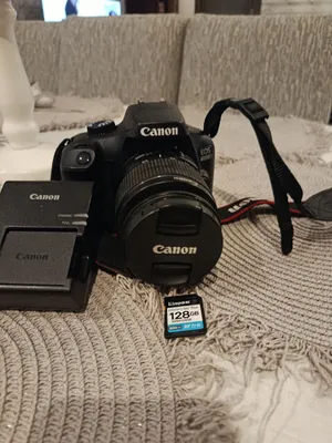 Canon 4000d used like new with charger battery and a 128 gb storage