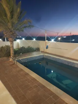 فيلا بمادبا بالقرب من جبل نيبو مع مسبح و ملعب