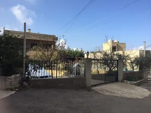 land with building for sale