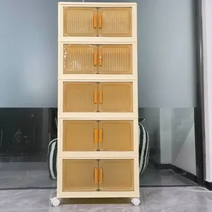 هذه خزانة تخزين بلاستيكية قابلة للطي ومكونة من 5 طبقات مع أبواب شفافة ذات لون أصفر فاتح ومقابض برتقا