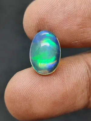 حجر أوبال أسود مزرق أثيوبي طبيعي مع فحص المختبر  natural Ethiopian black opal stone